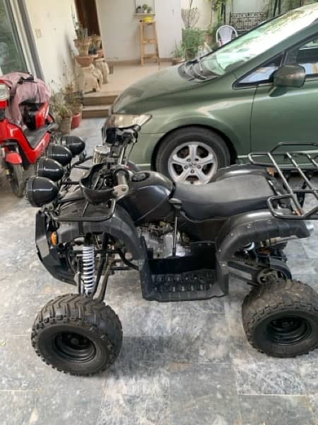 **very minimal used atv up for grab**(read info) 3