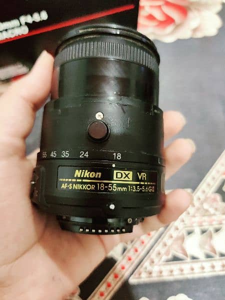 Nikon D5200 with a lens + 2 battries +charger and a sd card 1