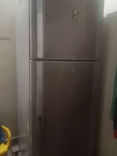 dawlance frige . . Gray color medium size. . . genuin gess A one cooling