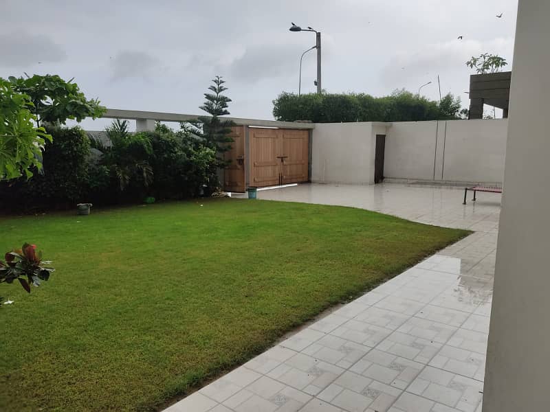 Dha Ph 8 Khe Ghalib | Architectural Marvel 1000 Yards 06 Bed House | Cosy Retreat Dining Room | Basement,Gymnasium,A State-Of-The-Art Home Theater | 10 Vehicle Parking | Servant Quaeter | Lush Greenery Lawn | 1