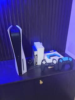 PS5 with two controllers and 2 games