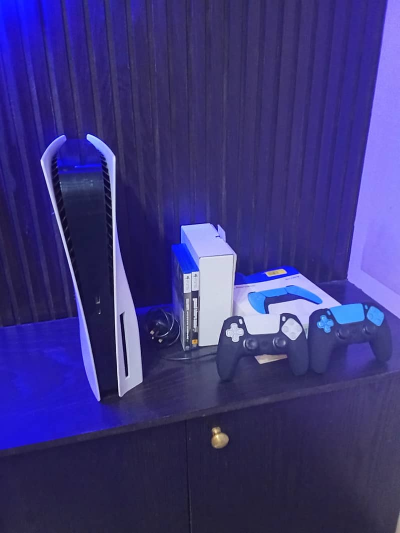 PS5 with two controllers and 2 games 3