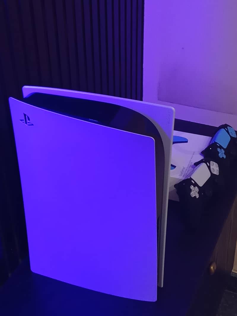 PS5 with two controllers and 2 games 5