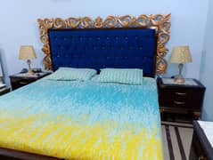 king size bed with sides table and dressing table.