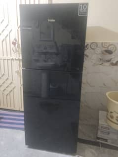 Haier 306 Amost new fridge in warrnty