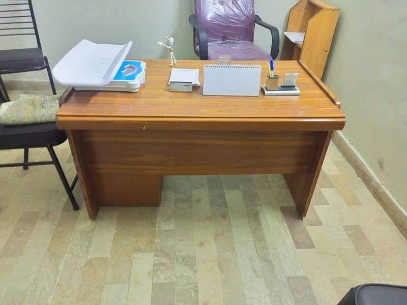 Slightly used office & clinic used table. . . . negotiated 1