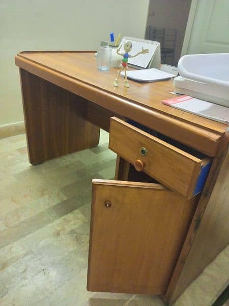 Slightly used office & clinic used table. . . . negotiated 3