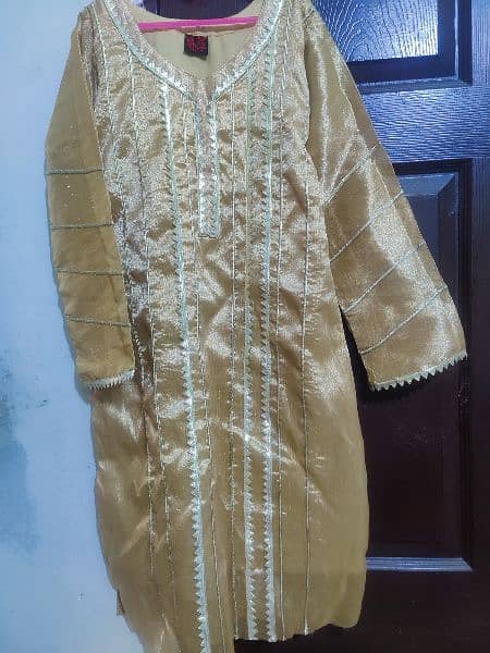 Golden shiny beautiful decent dress for any party wear. 1