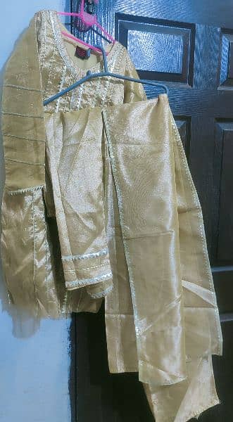 Golden shiny beautiful decent dress for any party wear. 2