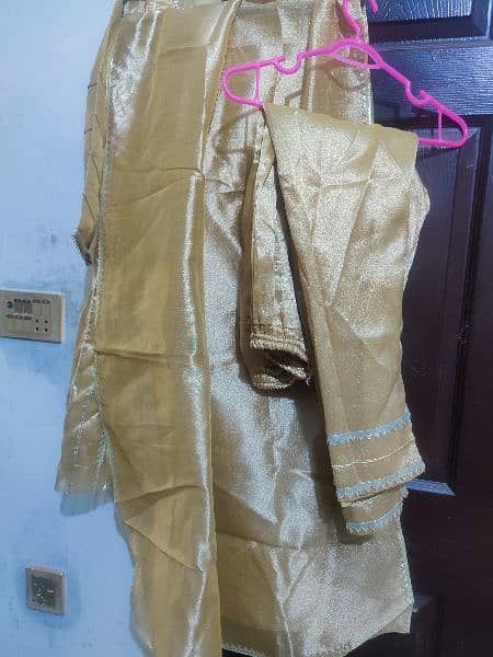 Golden shiny beautiful decent dress for any party wear. 3