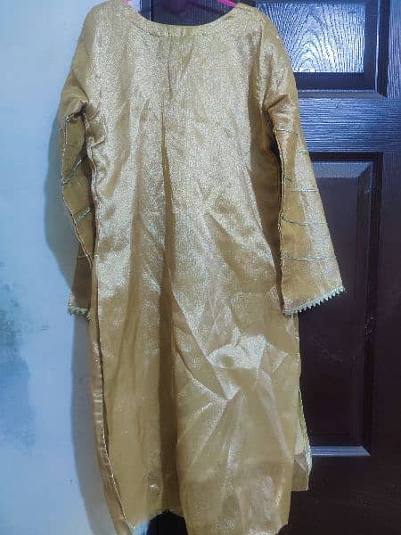 Golden shiny beautiful decent dress for any party wear. 5
