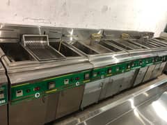 deep fryer, prep table, delivery bags, char coal grill, pizza oven