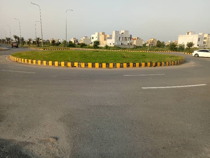 1 KANAL PLOT FOR SALE IN DHA PHASE 9 PRISM BLOCK C ALL DUES CLEAR CARPET ROAD 1