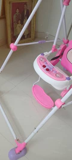 Pink baby swing