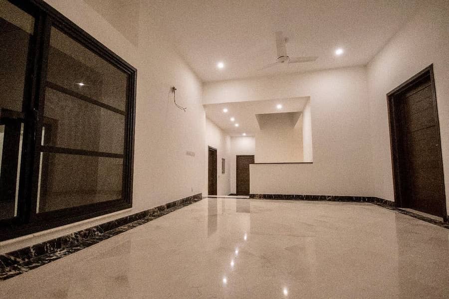Exquisite 1 Kanal House In DHA Phase 6 Modern Design, Prime Location, And Brand New Construction 13