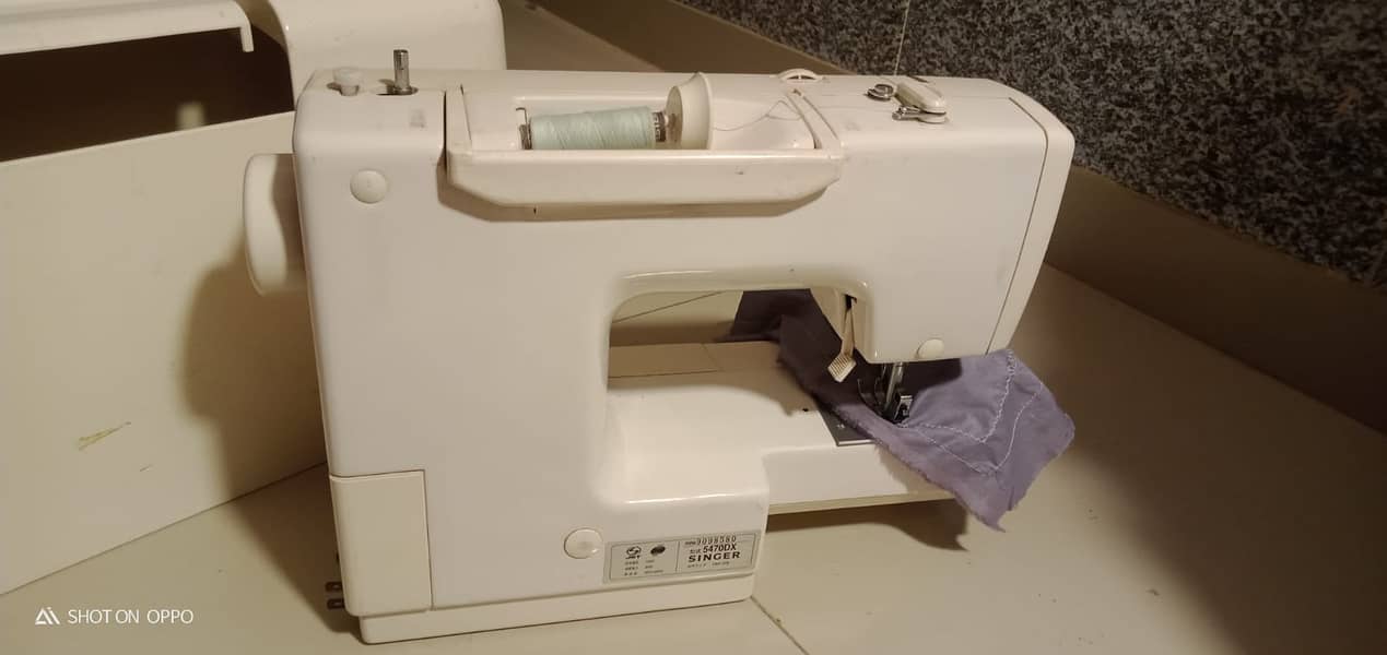 A unique style Japanese brand sewing machine. 9