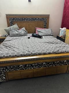 double bed with side tables and dressing