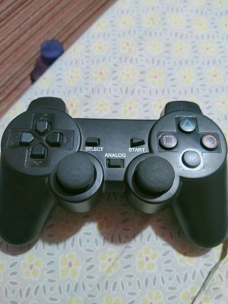 Playstation 2 with controllers and games 3