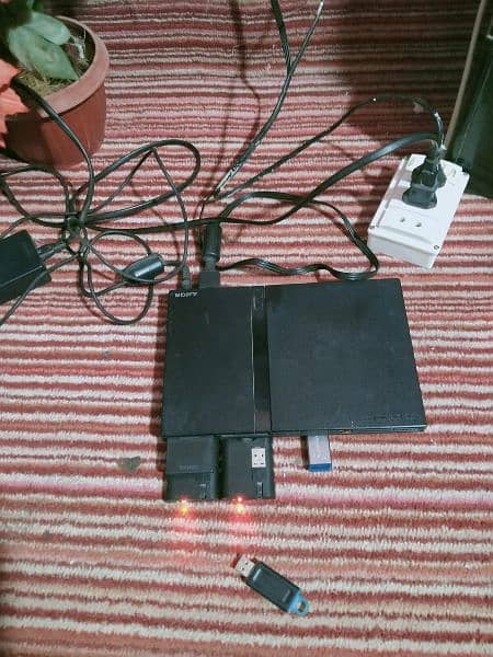 Playstation 2 with controllers and games 5