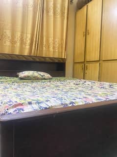 queen size bed woth two side tables and dressing and matress