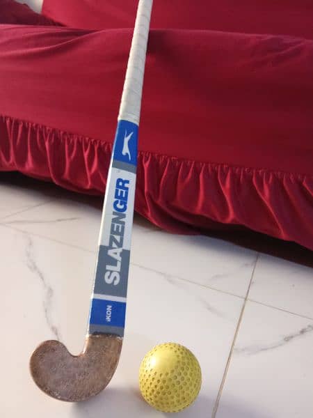 hockey stick for sale . ,with hockey ball . 0