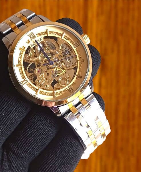 Rolex men's watch
Automatic movement 
Steal chain
Skeleton dail 1