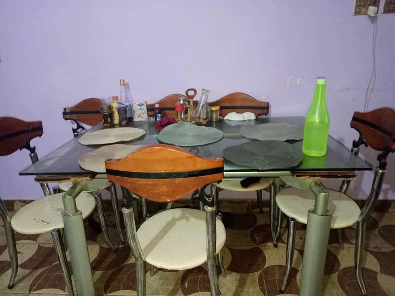 dining table with 6 wood and iron chairs 1