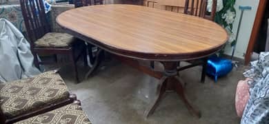 Wooden dining table with 6 chairs (price negotiable)