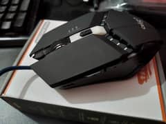 Gaming mouse with sensitivity control and 4 click buttons