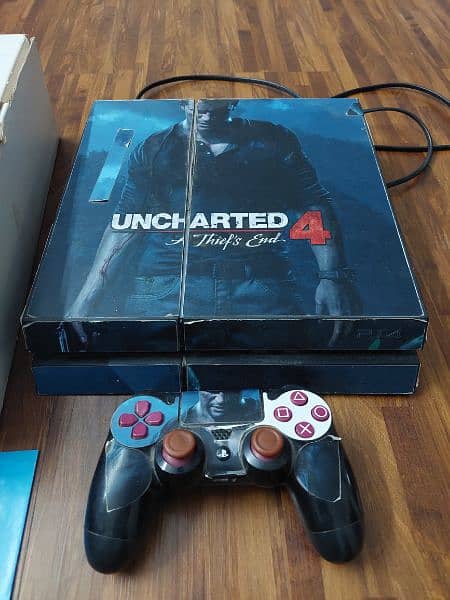 PlayStation 4 with box and 1 controller and original handfree 0