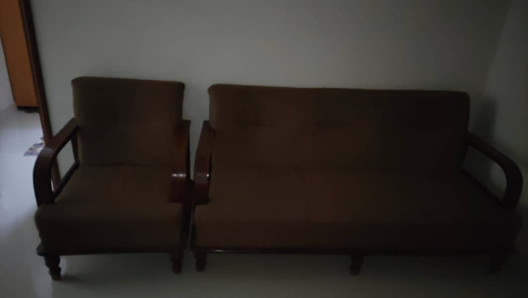 Brown colour sofas 1 seated and 2 seated  4 years used but minimal 2