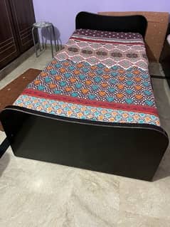 Single bed with spring mattress