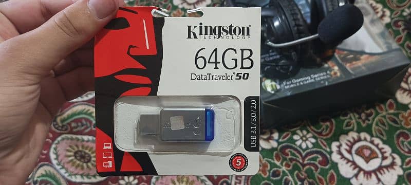 Headphone or Kingston USB or lenevo mouse or mouse pad 1