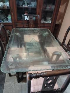 wooden frame dinning table with solid glass top with 4 chairs