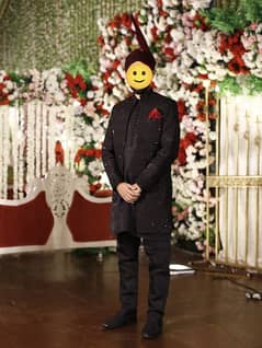 Black sherwani with red kulla , black shoes and inner suit