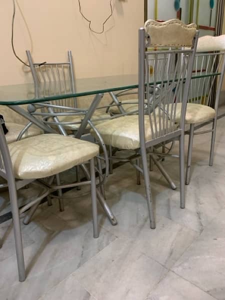 Glass dining table for sale With 6 chairs 1