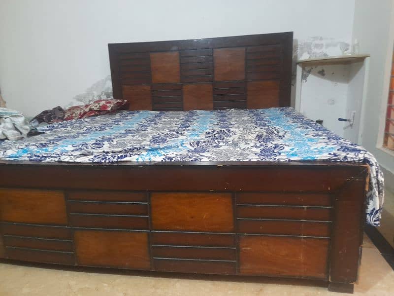 wooden bed with mattress 0