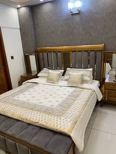 Bed with mattress and dresser