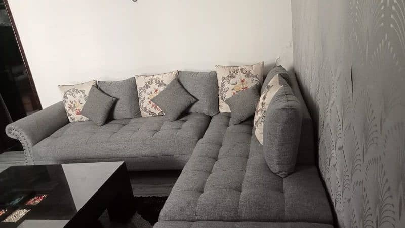 7 seater L shaped Sofa in Charcoal grey colour me 3
