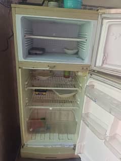 Medium size Fridge good and Running condition  without steplizer 20000