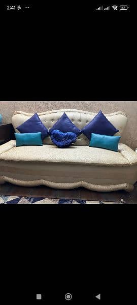 5 seater sofa set off-white colour and blue cushions and table. 1