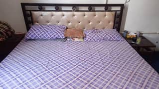 Iron King bed with diamond mattress.