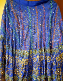 a beautifu peacock bluel skirt. peral work all over.