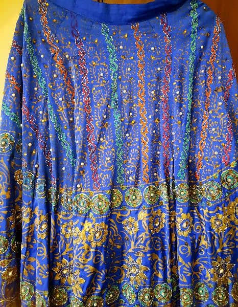 a beautifu peacock bluel skirt. peral work all over. 0