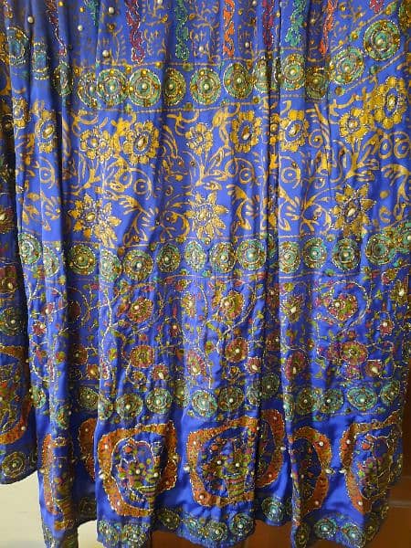 a beautifu peacock bluel skirt. peral work all over. 1