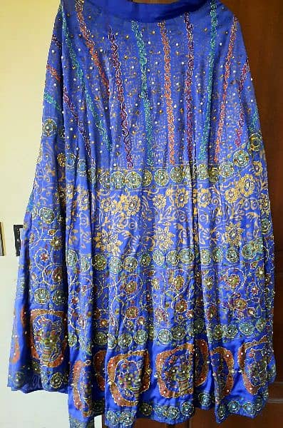 a beautifu peacock bluel skirt. peral work all over. 2