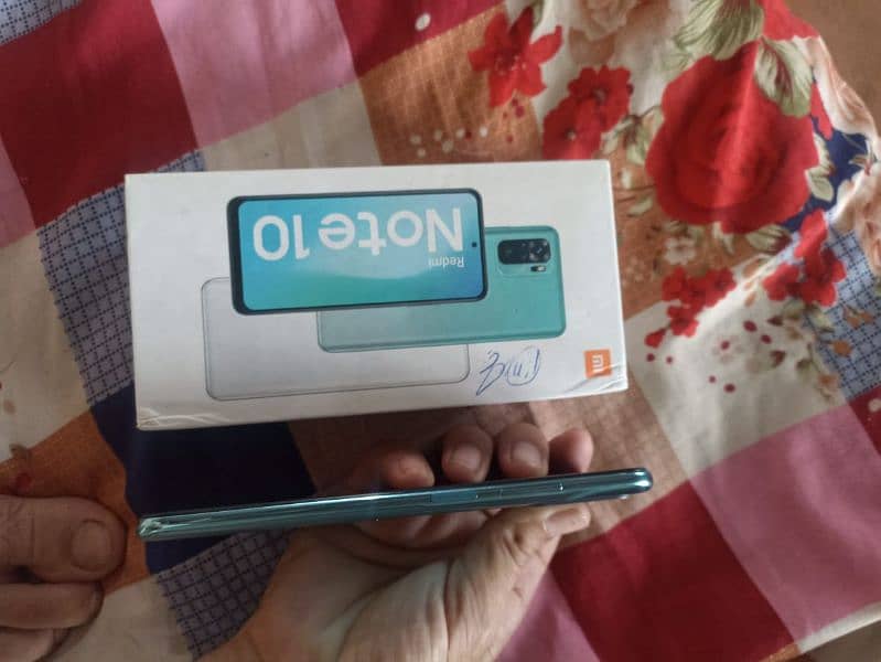 Ridmi Note 10 4Gb Ram 128 GB Rom good condition with box charg. . . 1