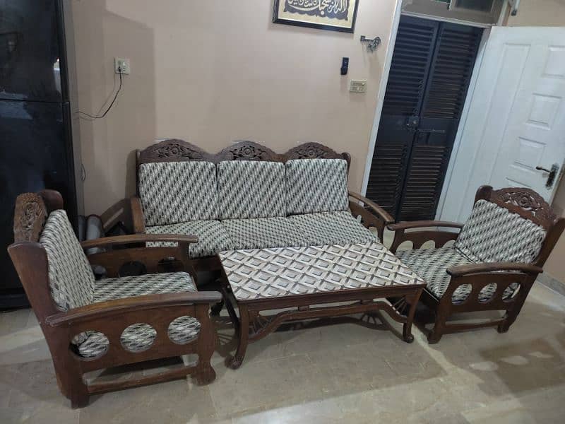 WOODEN SOFA SET WITH TABLE. 0