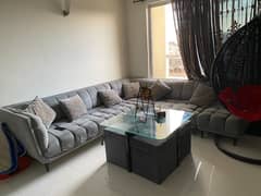 L shaped sofa with table and Chairs