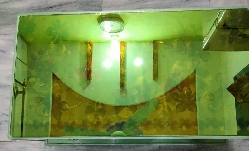 Plastic table with glass top for sale. 1